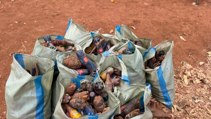 Sacks of collected plastic bottles and litter after a clean-up